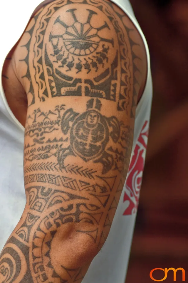 Photo of Cook Islands traditional tattoo on a man's arm and shoulder. Taken by Amanda Fornal in October 2006.