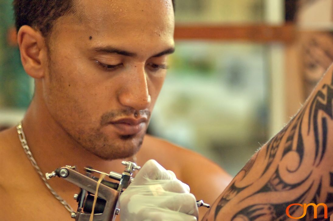 Photo of a man getting a Cook Islands traditional tattoo. Taken by Amanda Fornal in October 2006.