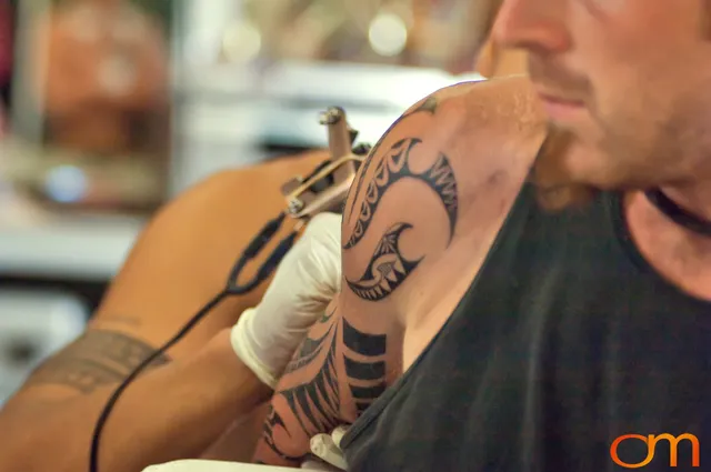 Photo of a man getting a Cook Islands traditional tattoo. Taken by Amanda Fornal in October 2006.