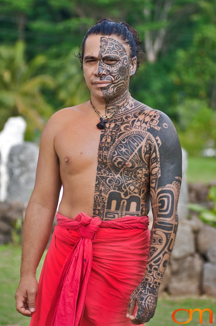 Photo of Polynesian traditional tattoos on a man's face and body. Taken of Tihoti on the island of Huahine by Amanda Fornal in November 2006.