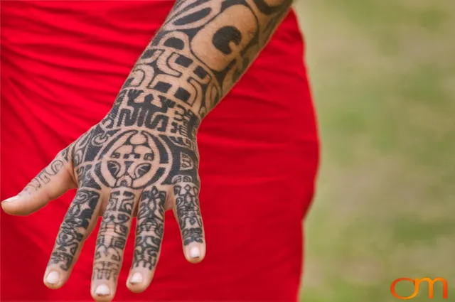 Photo of Polynesian traditional tattoos on a man's hand. Taken of Tihoti on the island of Huahine by Amanda Fornal in November 2006.