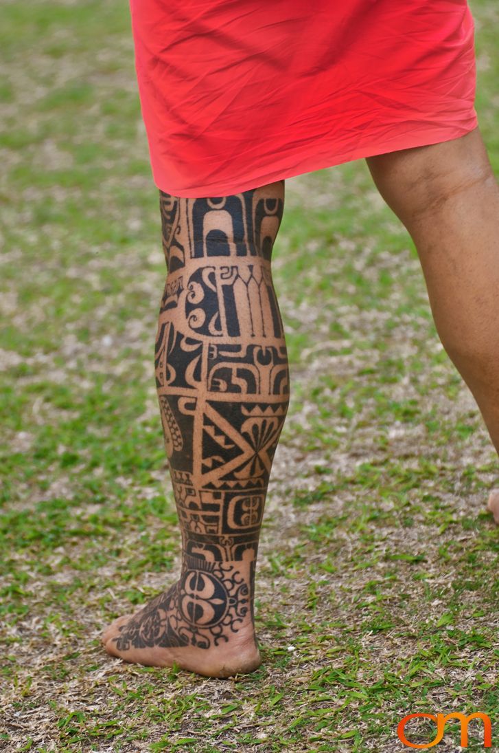 Photo of Polynesian traditional tattoos on a man's leg and foot. Taken of Tihoti on the island of Huahine by Amanda Fornal in November 2006.