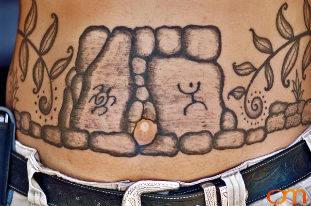 Photo of Polynesian traditional tattoo on a man's stomach. Taken on the island of Huahine by Amanda Fornal in November 2006.