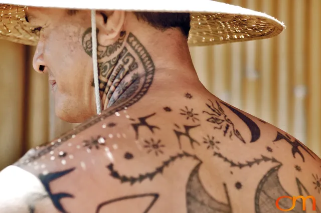 Photo of Polynesian traditional tattoos on a man's back and neck. Taken on the island of Huahine by Amanda Fornal in November 2006.