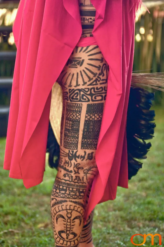 Photo of Polynesian traditional tattoos on a man's leg. Taken at the 2006 Tattoonesia tattoo festival of Raymond Graffe by Amanda Fornal in December 2006.