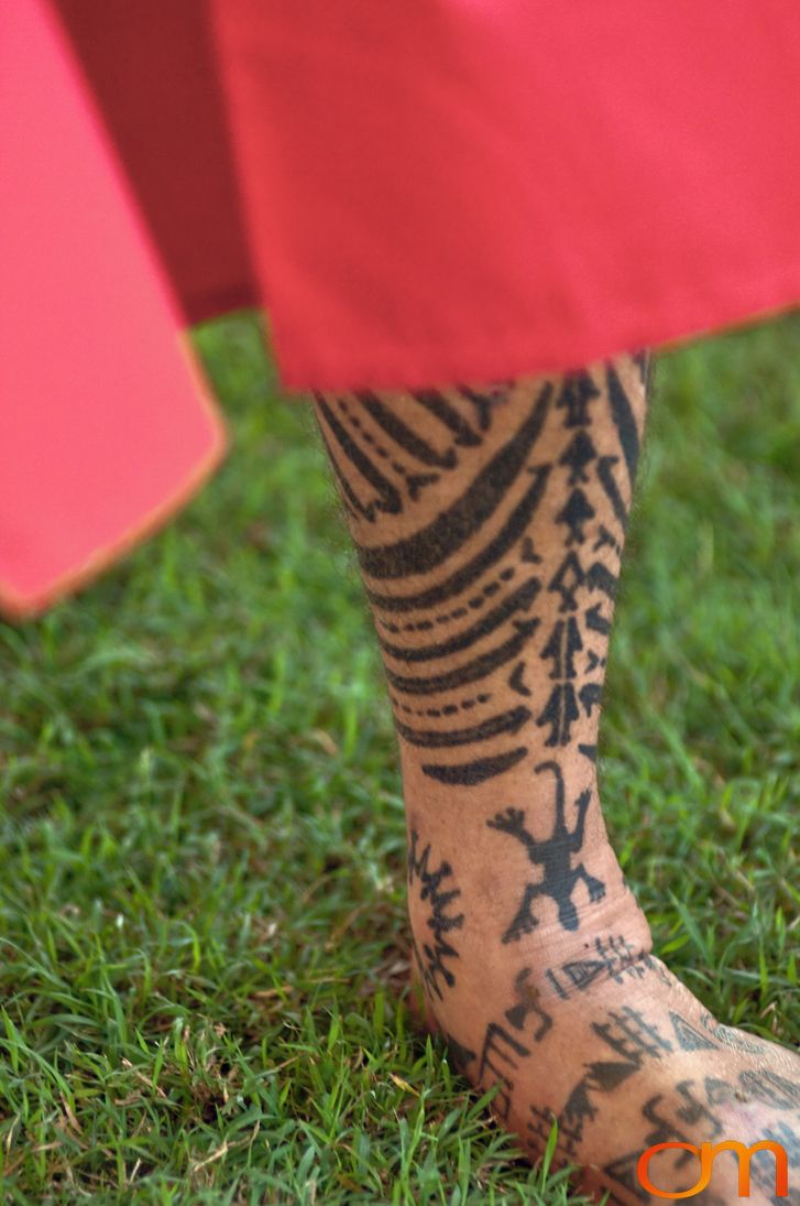 Photo of Polynesian traditional tattoos on a man's leg and foot. Taken at the 2006 Tattoonesia tattoo festival of Raymond Graffe by Amanda Fornal in December 2006.