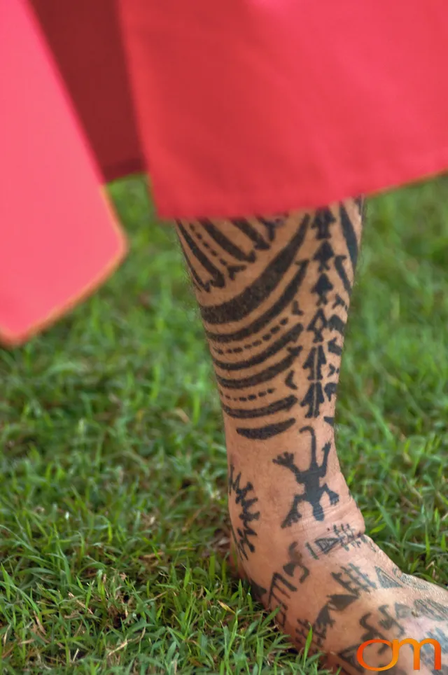 Photo of Polynesian traditional tattoos on a man's leg and foot. Taken at the 2006 Tattoonesia tattoo festival of Raymond Graffe by Amanda Fornal in December 2006.