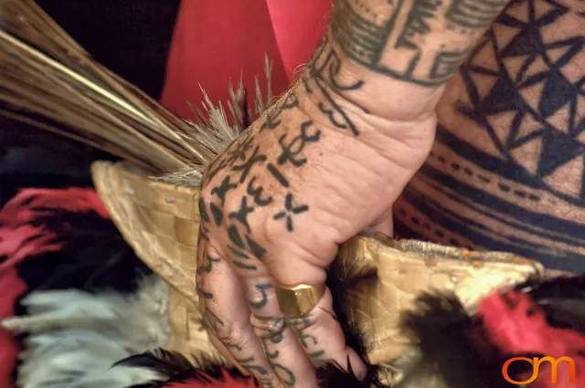 Photo of Polynesian traditional tattoos on a man's hand and leg. Taken at the 2006 Tattoonesia tattoo festival of Raymond Graffe by Amanda Fornal in December 2006.