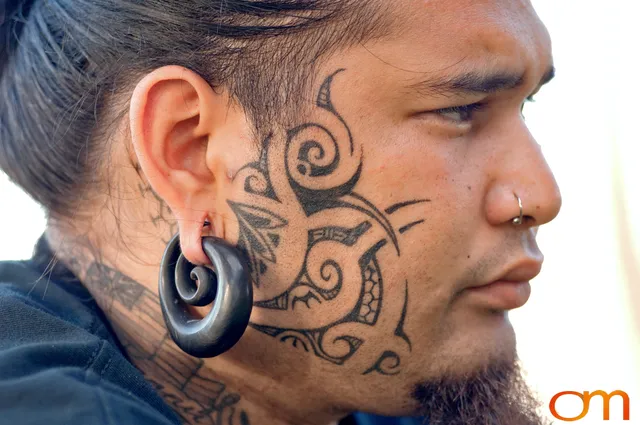 Photo of Polynesian traditional tattoo on a man's face. Taken at the 2006 Tattoonesia tattoo festival of Onu by Amanda Fornal in December 2006.