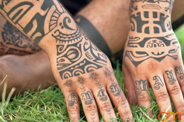 Photo of Polynesian traditional tattoo on a man's hands and arms. Taken at the 2006 Tattoonesia tattoo festival of Onu by Amanda Fornal in December 2006.