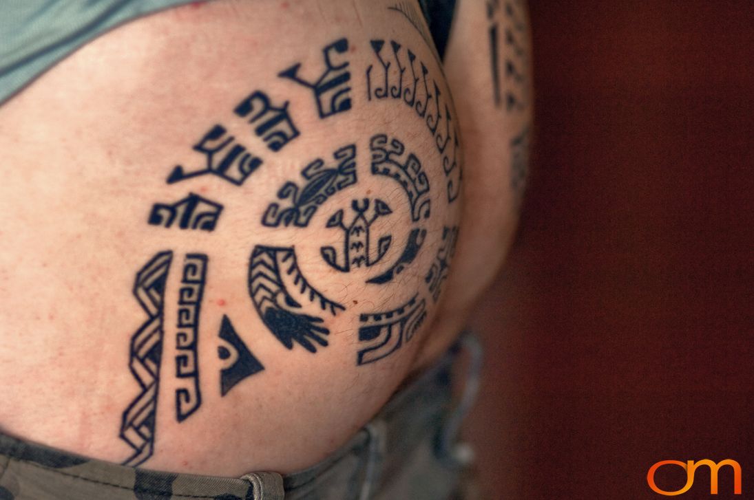 Photo of traditional tattoo designs on a man's arm. Taken of Steven Ball at the 2006 Tattoonesia tattoo festival by Amanda Fornal in December 2006.