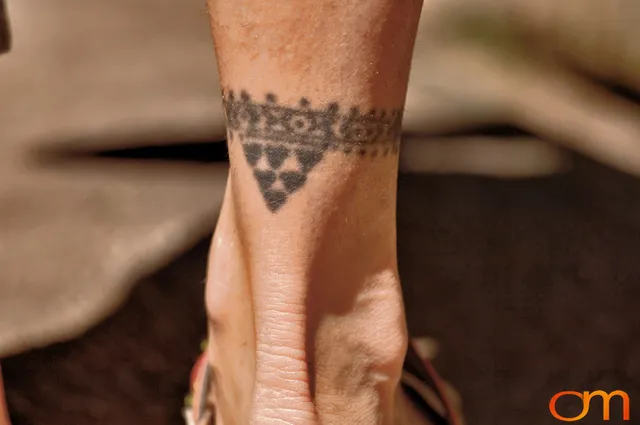 Photo of Polynesian traditional tattoos on a woman's ankle. Taken at the 2006 Tattoonesia tattoo festival by Amanda Fornal in December 2006.