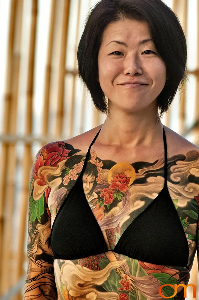 Photo of a Japanese bodysuit tattoo on a woman. Taken at the 2006 Tattoonesia tattoo festival of Yoko by Amanda Fornal in December 2006.