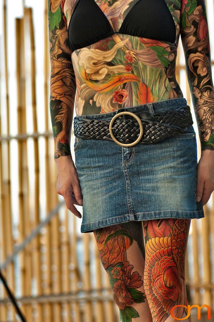 Photo of a Japanese bodysuit tattoo on a woman. Taken at the 2006 Tattoonesia tattoo festival of Yoko by Amanda Fornal in December 2006.