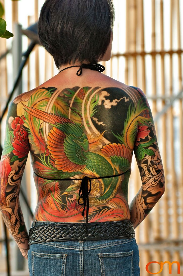 Photo of a Japanese bodysuit tattoo on a woman. Taken at the 2006 Tattoonesia tattoo festival of Yoko by Amanda Fornal in December 2006.