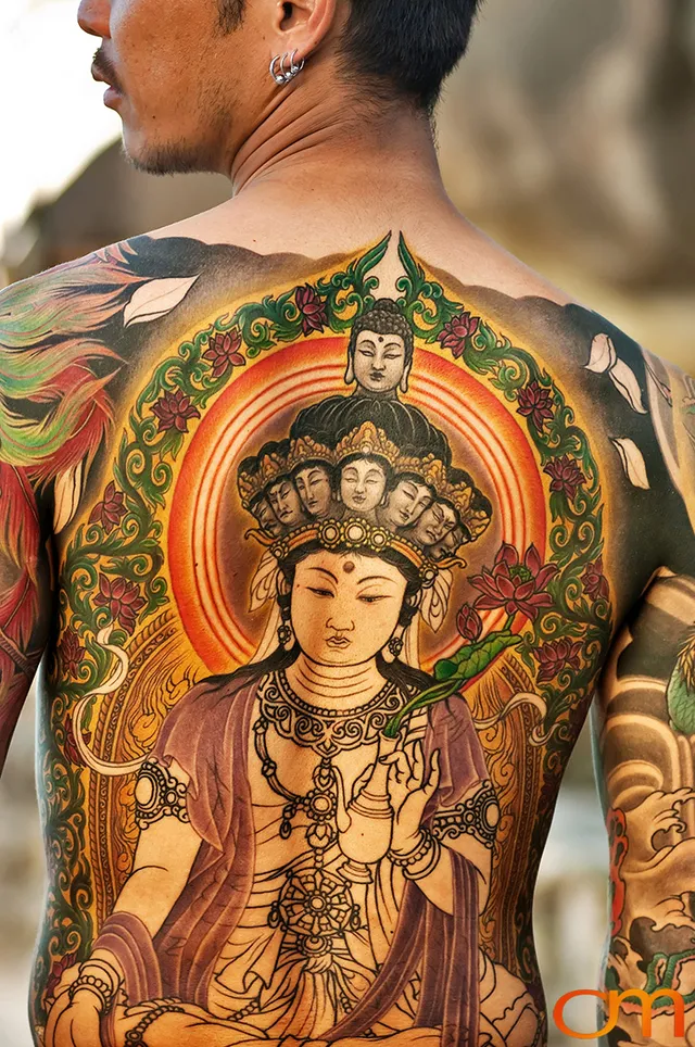 Photo of a Japanese bodysuit tattoo on a man. Taken at the 2006 Tattoonesia tattoo festival by Amanda Fornal in December 2006.