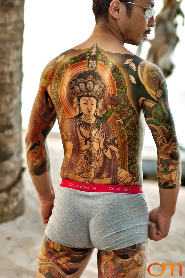 Photo of a Japanese bodysuit tattoo on a man. Taken at the 2006 Tattoonesia tattoo festival by Amanda Fornal in December 2006.