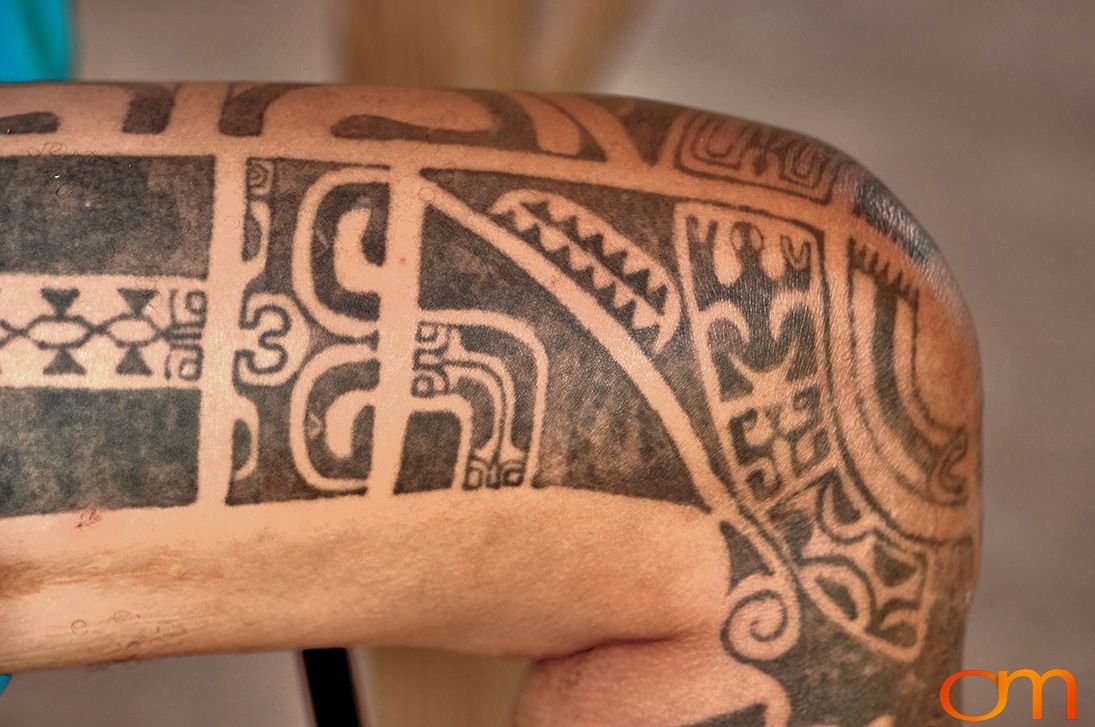 Photo of Polynesian traditional tattoos on a man's leg. Taken of Santos on the Marquesas island of Hiva Oa by Amanda Fornal in October 2006.