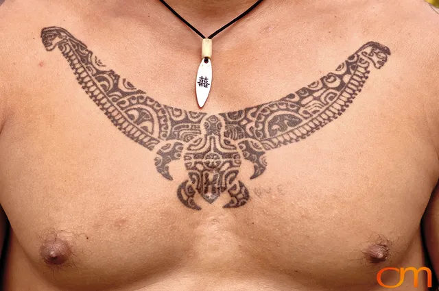 Photo of Polynesian traditional tattoos on a man's chest. Taken of Santos on the Marquesas island of Hiva Oa by Amanda Fornal in October 2006.