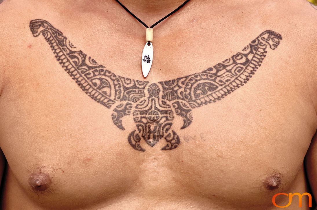 Photo of Polynesian traditional tattoos on a man's chest. Taken of Santos on the Marquesas island of Hiva Oa by Amanda Fornal in October 2006.