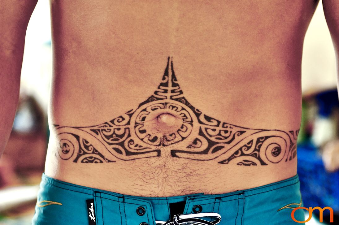 Photo of Polynesian traditional tattoos on a man's stomach. Taken of Santos on the Marquesas island of Hiva Oa by Amanda Fornal in October 2006.