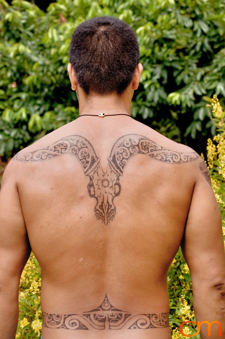 Photo of Polynesian traditional tattoos on a man's back. Taken of Santos on the Marquesas island of Hiva Oa by Amanda Fornal in October 2006.