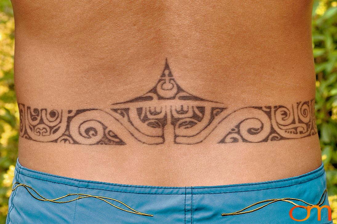 Photo of Polynesian traditional tattoos on a man's back. Taken of Santos on the Marquesas island of Hiva Oa by Amanda Fornal in October 2006.