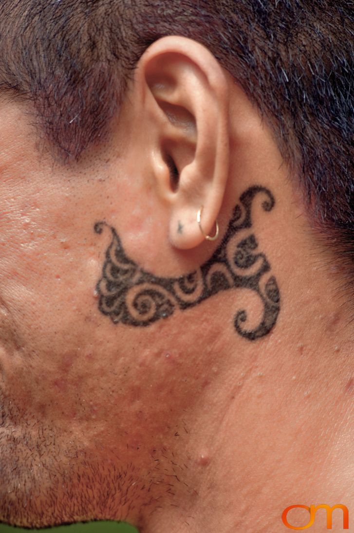 Photo of Polynesian traditional tattoo on a man's face. Taken of Santos on the Marquesas island of Hiva Oa by Amanda Fornal in October 2006.