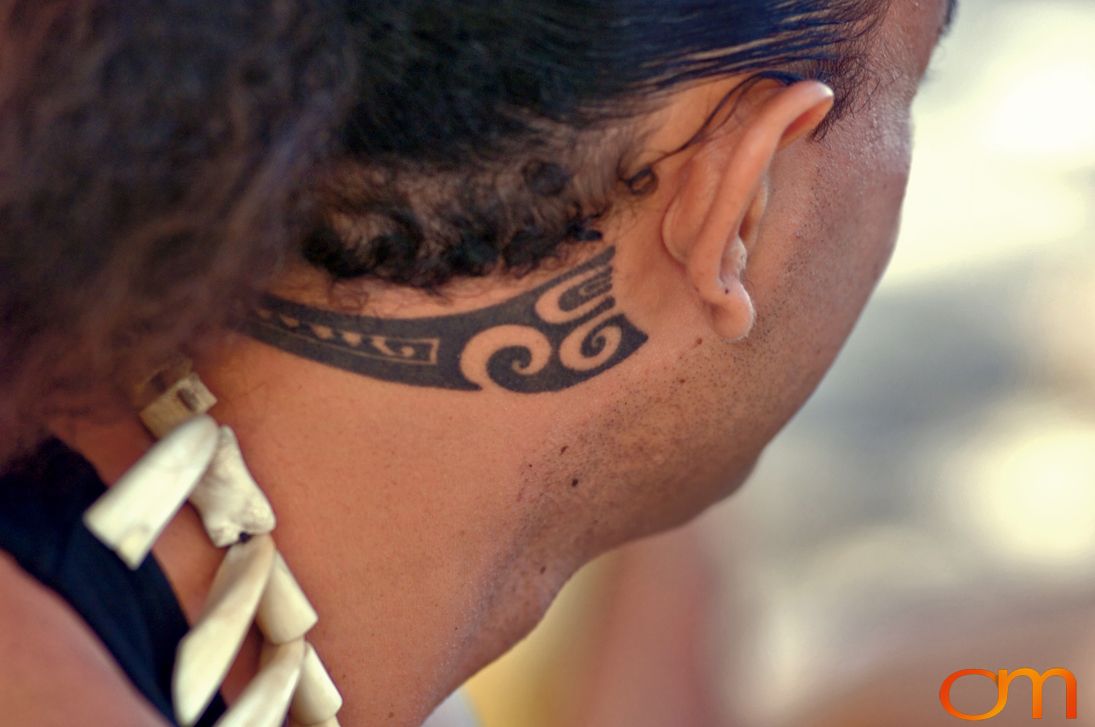 Photo of Polynesian traditional tattoo on a man's neck. Taken of Jean Eve on the Marquesas island of Nuku Hiva by Amanda Fornal in October 2006.