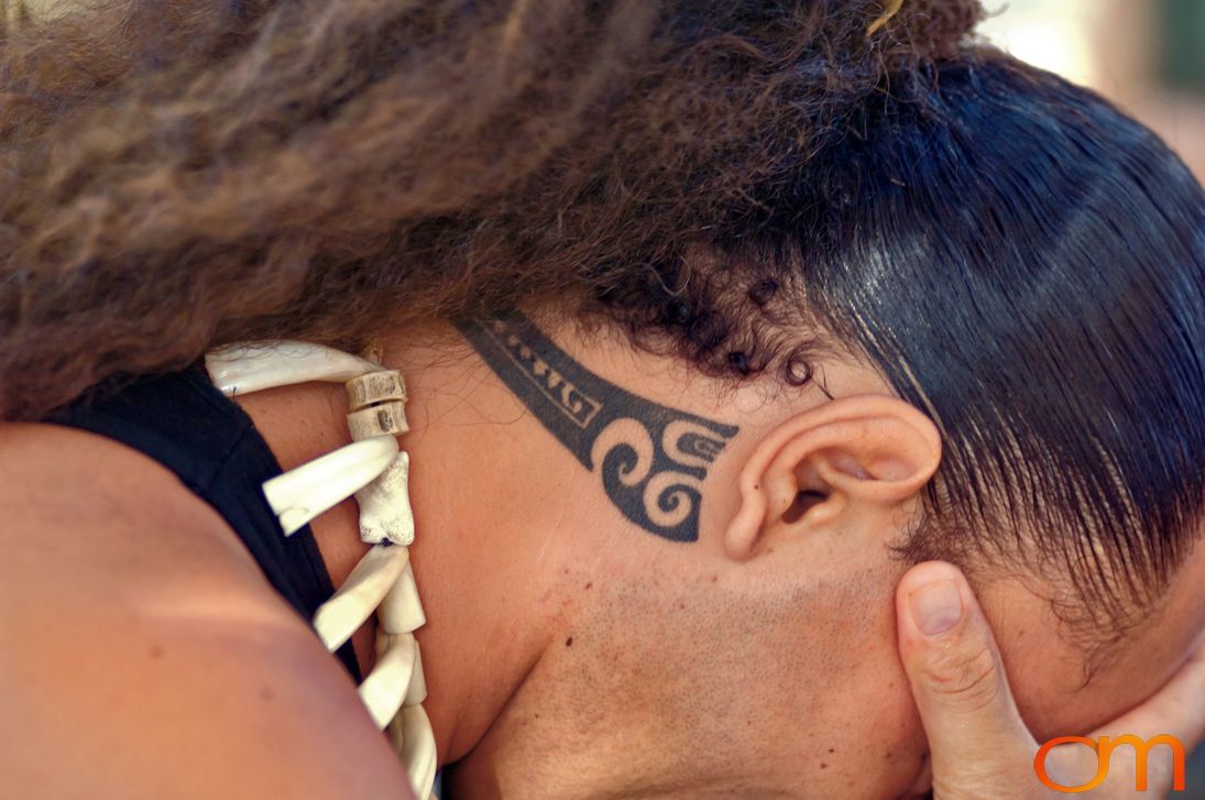 Photo of Polynesian traditional tattoo on a man's neck. Taken of Jean Eve on the Marquesas island of Nuku Hiva by Amanda Fornal in October 2006.