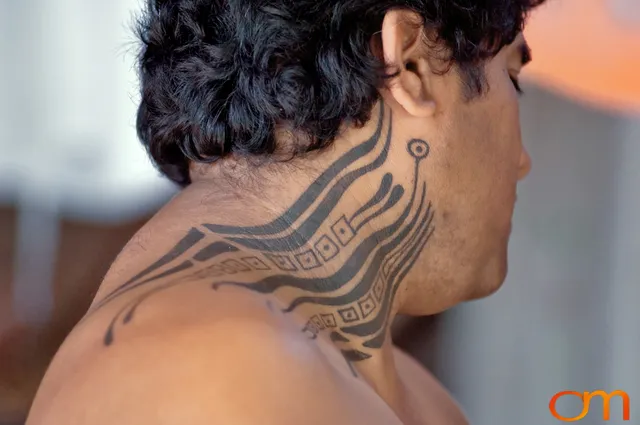 Photo of Rapa Nui (Easter Island) traditional tattoo on a man's neck. Taken of Julio by Amanda Fornal in December 2006.