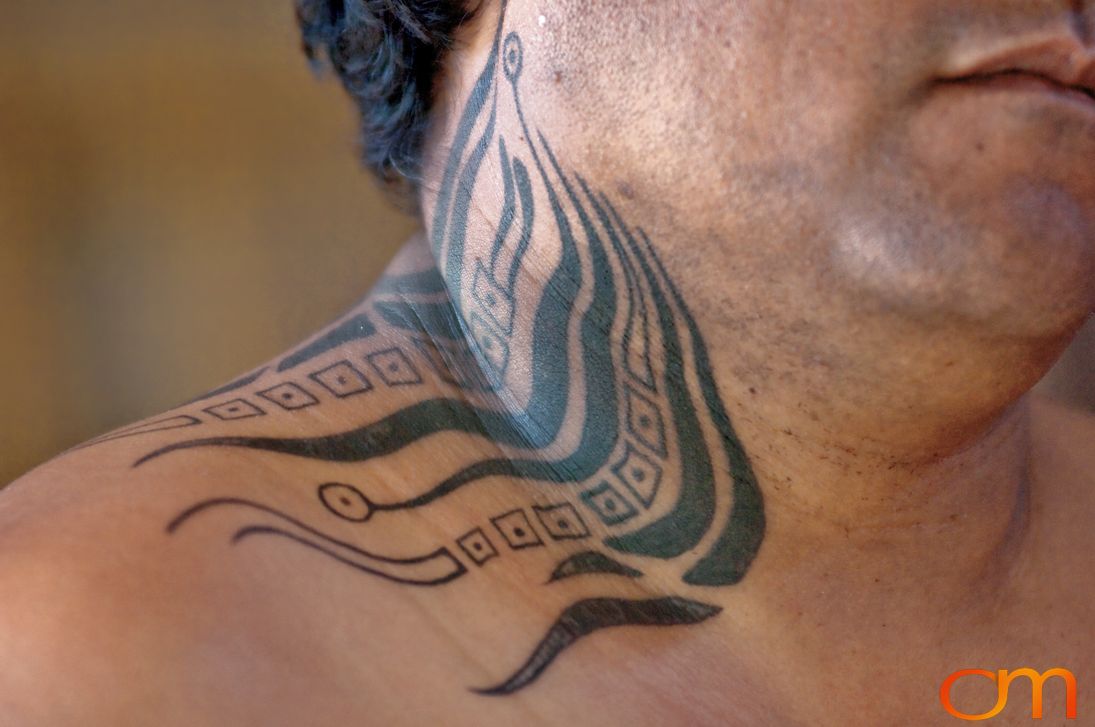 Photo of Rapa Nui (Easter Island) traditional tattoo on a man's neck. Taken of Julio by Amanda Fornal in December 2006.