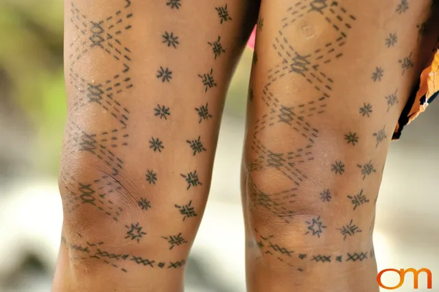 Photo of a woman with traditional Samoan tattoo. Taken of Anastasia on the island of Upolu by Amanda Fornal in September 2006.