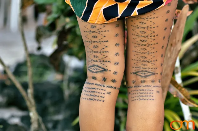 Photo of a woman with traditional Samoan tattoo. Taken of Anastasia on the island of Upolu by Amanda Fornal in September 2006.