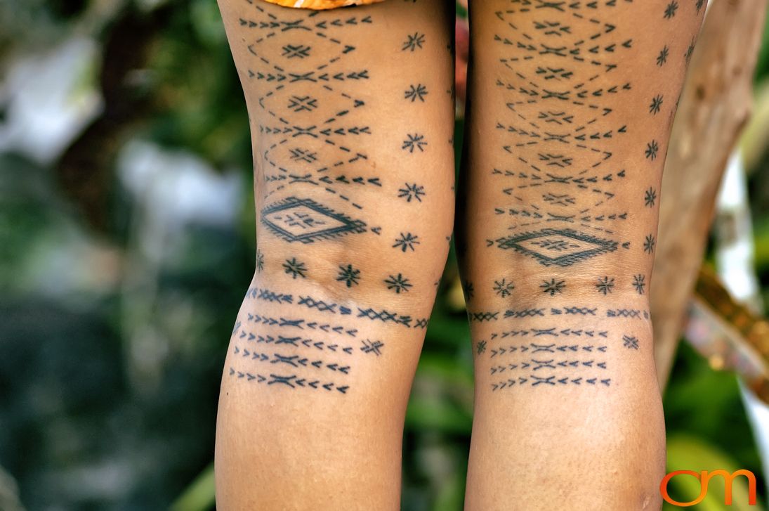 Photo of a woman with traditional Samoan tattoo. Taken of Anastasia on the island of Upolu by Amanda Fornal in September 2006.