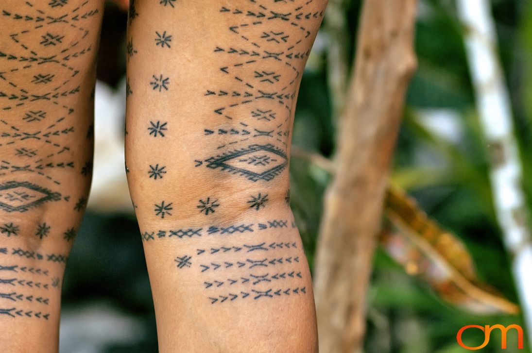 Photo of a woman with traditional Samoan tattoo. Taken of Anastasia on the island of Upolu by Amanda Fornal in September 2006.