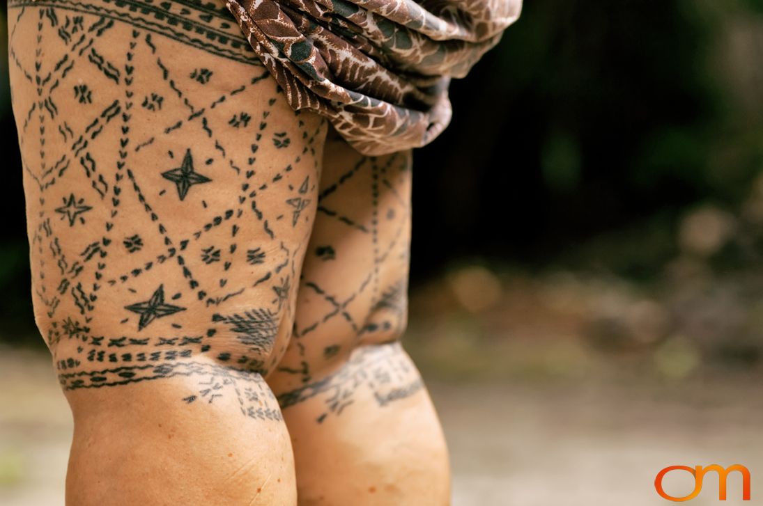 Photo of a woman with traditional Samoan tattoo. Taken of Mogli on the island of Savai’i by Amanda Fornal in September 2006.