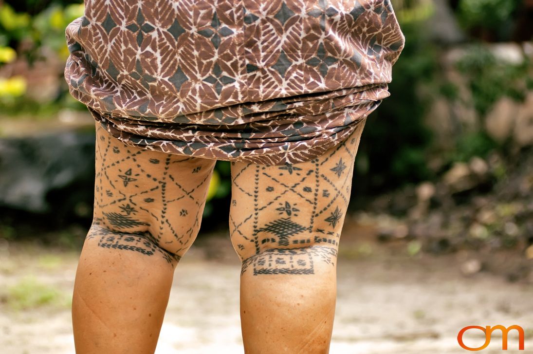 Photo of a woman with traditional Samoan tattoo. Taken of Mogli on the island of Savai’i by Amanda Fornal in September 2006.