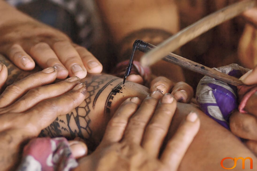 Photo of a man getting a traditional Samoan tattoo. Taken of Chris on the island of Savai’i by Amanda Fornal in September 2006.