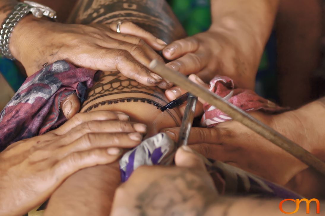 Photo of a man getting a traditional Samoan tattoo. Taken of Chris on the island of Savai’i by Amanda Fornal in September 2006.