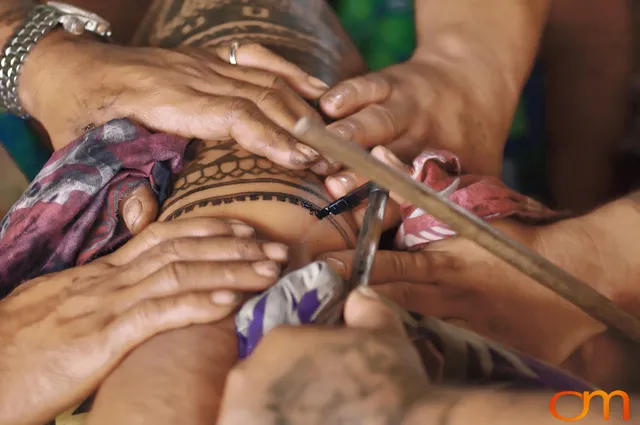 Photo of a man getting a traditional Samoan tattoo. Taken of Chris on the island of Savai’i by Amanda Fornal in September 2006.