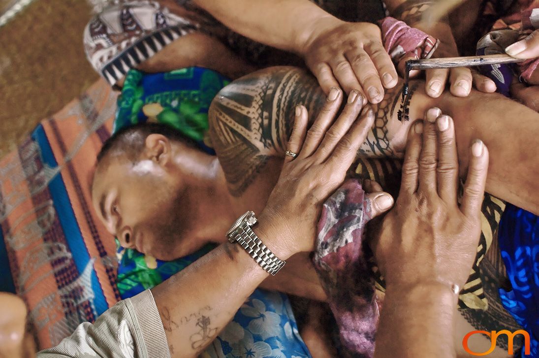 Photo of a man getting a traditional Samoan tattoo. Taken of Chris on the island of Savai’i by Amanda Fornal in September 2006.