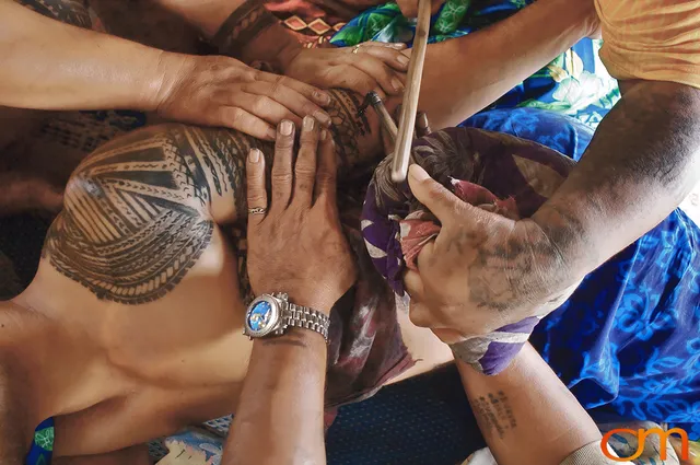 Photo of a man getting a traditional Samoan tattoo. Taken of Chris on the island of Savai’i by Amanda Fornal in September 2006.