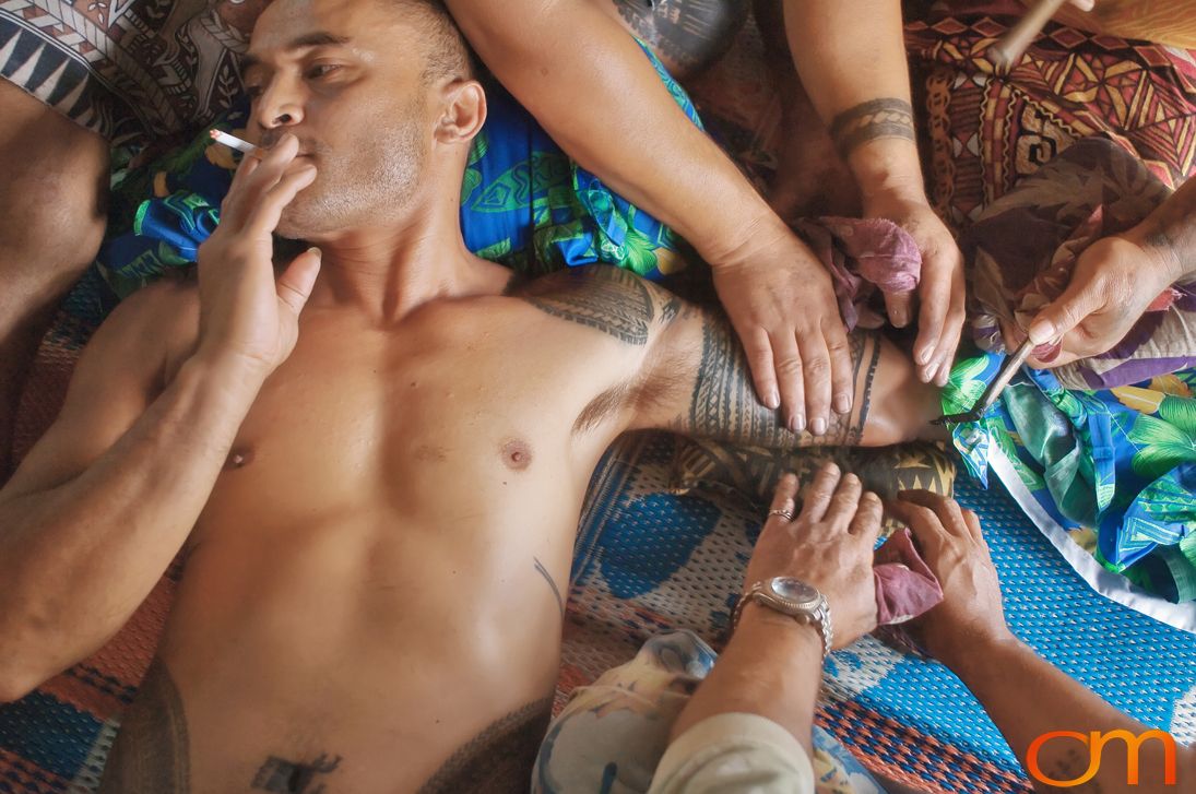 Photo of a man getting a traditional Samoan tattoo. Taken of Chris on the island of Savai’i by Amanda Fornal in September 2006.