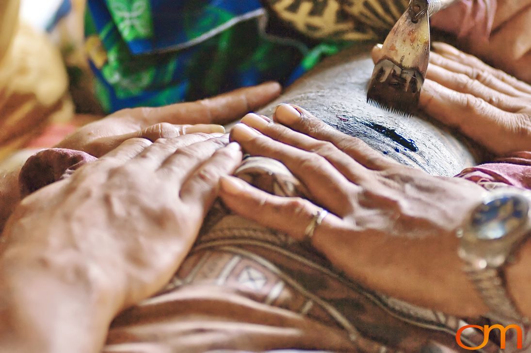 Photo of a man getting a traditional Samoan tattoo. Taken on the island of Savai’i by Amanda Fornal in September 2006.