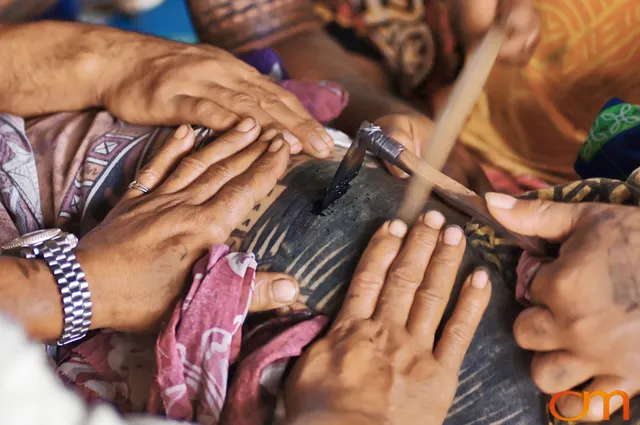 Photo of a man getting a traditional Samoan tattoo. Taken on the island of Savai’i by Amanda Fornal in September 2006.