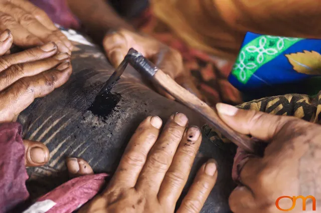 Photo of a man getting a traditional Samoan tattoo. Taken on the island of Savai’i by Amanda Fornal in September 2006.