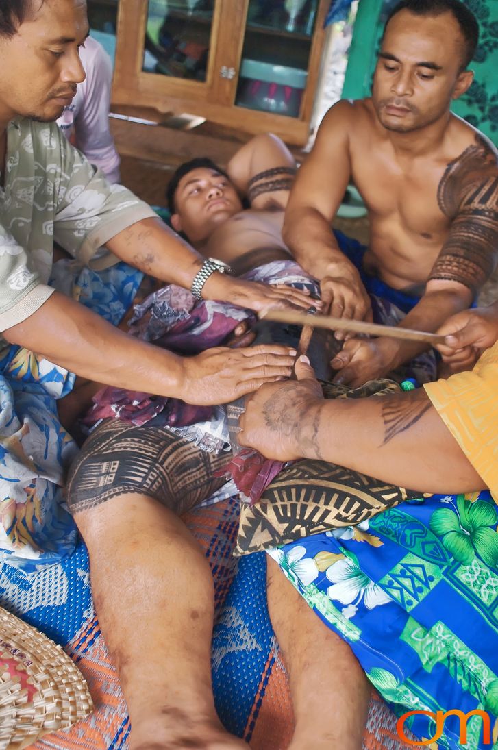 Photo of a man getting a traditional Samoan tattoo. Taken on the island of Savai’i by Amanda Fornal in September 2006.