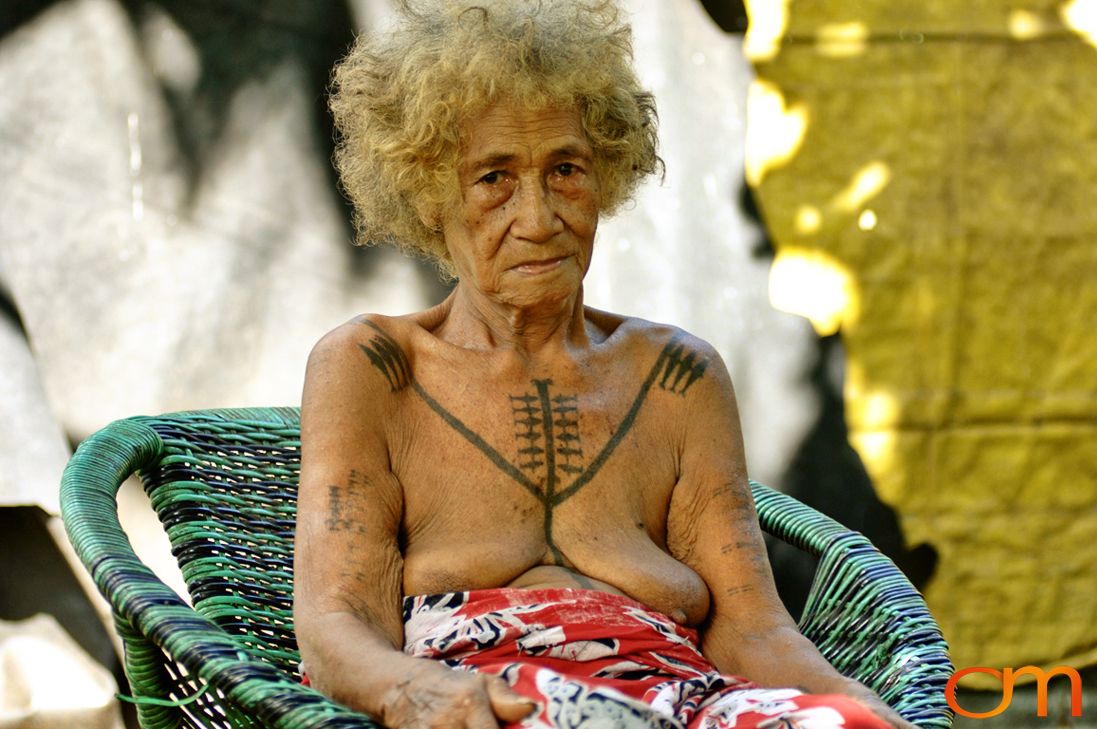 Photo of a woman with Solomon Island traditional tattoos. Taken on the island of Bellona by Amanda Fornal in December 2006.