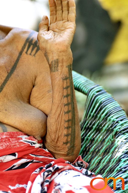 Photo of a woman with Solomon Island traditional tattoos. Taken on the island of Bellona by Amanda Fornal in December 2006.